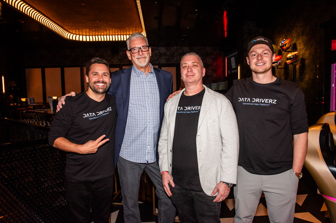 The Data Driverz team in branded shirts at a company event